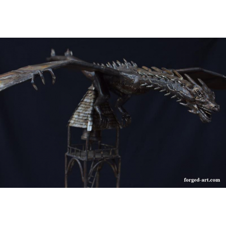 forged figure of smaug on the tower